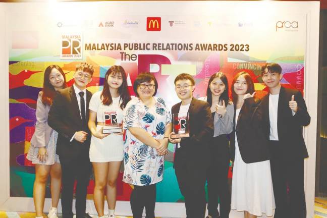 Diong (fourth from left) celebrating success with UTAR PR communication students at MPRA 2023