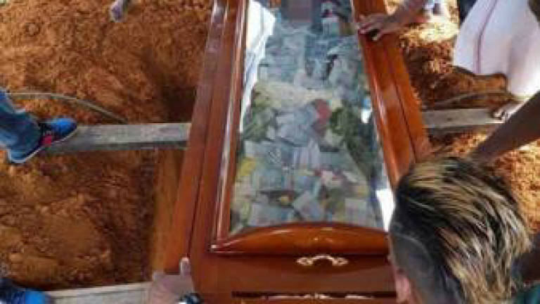 Man buries father with RM30,000 cash in coffin