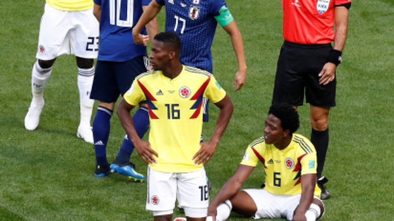 Red card derails Colombia plans while Japan make World Cup history