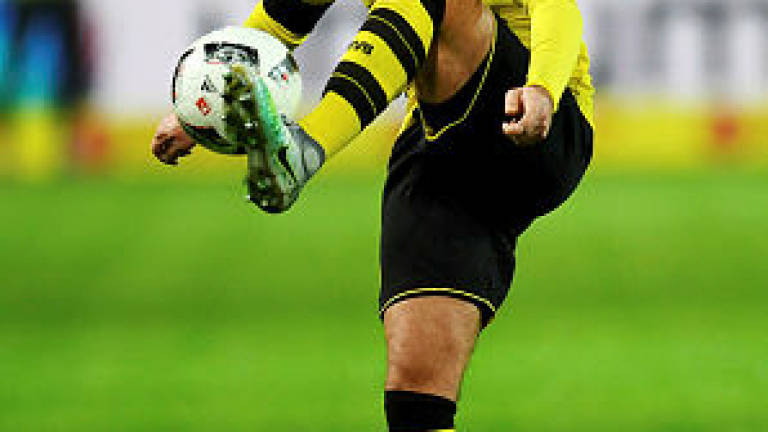 Dortmund resume without Reus, wait on Goetze