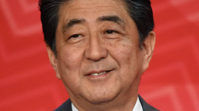 Japan's Abe heads to Argentina on trade