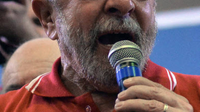 Brazil's wounded political giant Lula vows to fight on