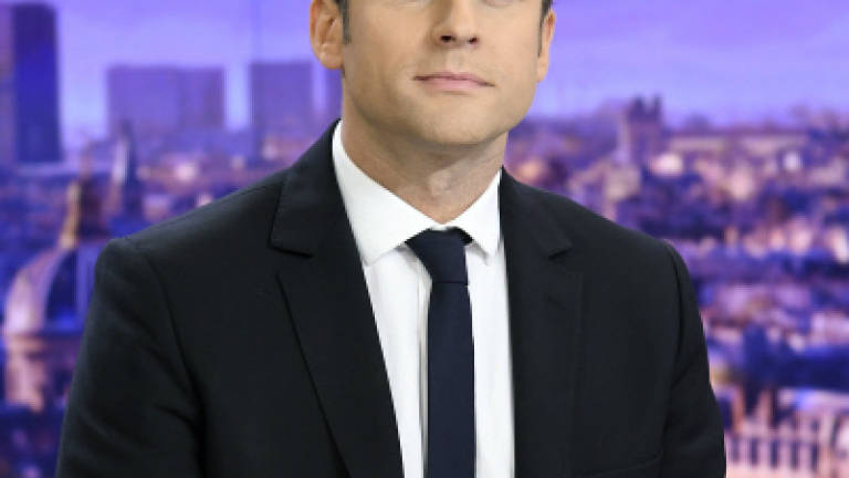 France's Macron says 'nothing's won yet'