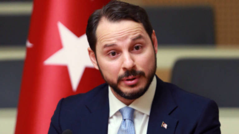 Erdogan takes on new powers, names son-in-law finance chief