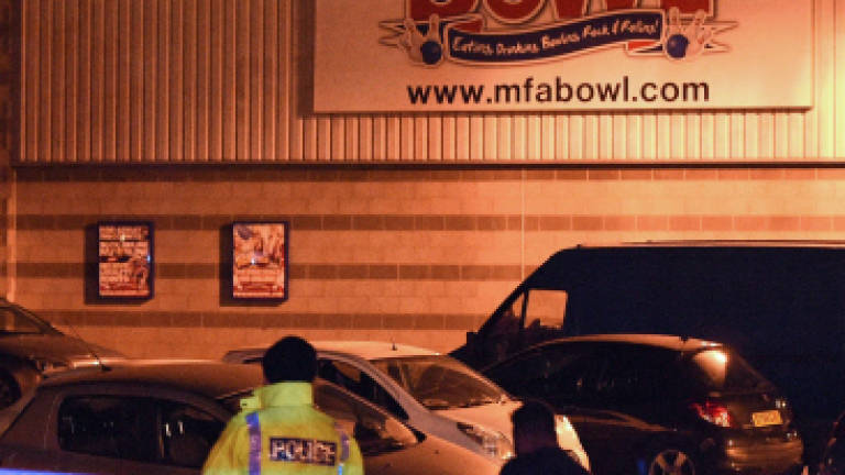 Gunman arrested, hostages freed at British bowling alley