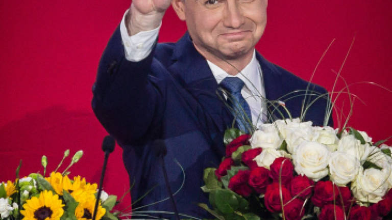 Conservative newcomer Duda wins Polish presidential cliffhanger