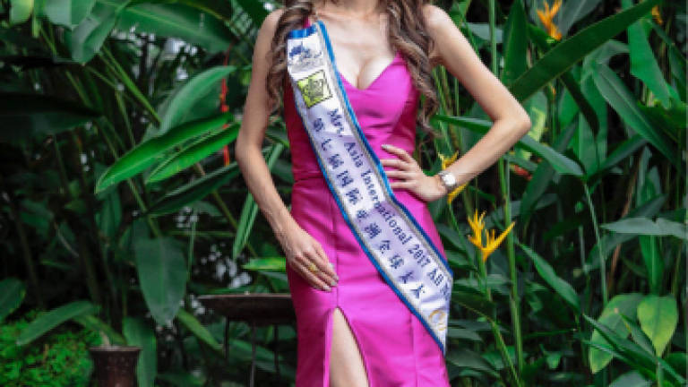 Beauty pageant winner fought her fears and remembered her country to win the crown
