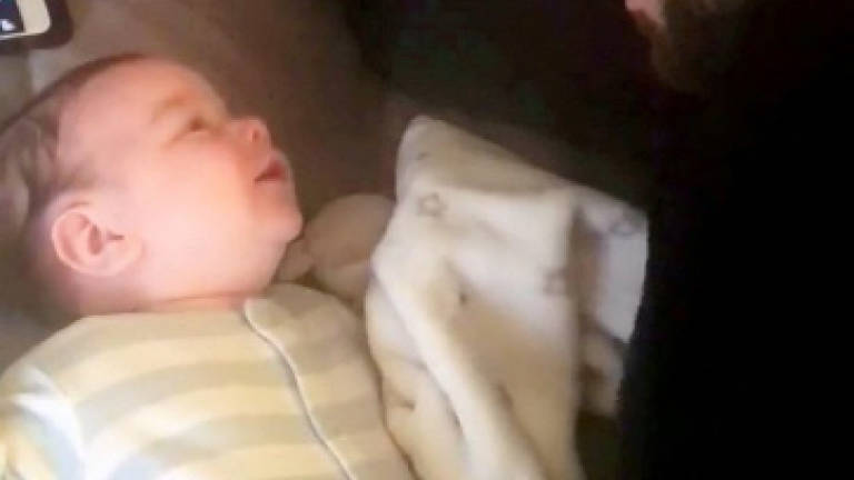 Baby says hello to father at just 12 weeks old