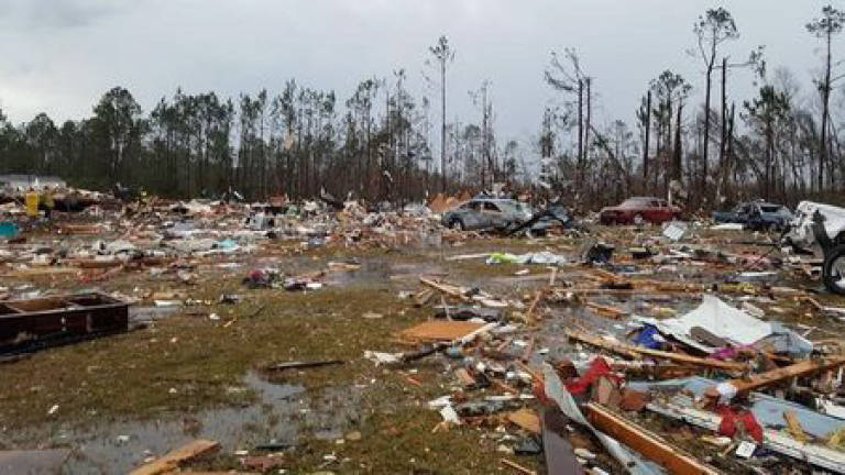 Powerful storms kill at least 16 in southeast US