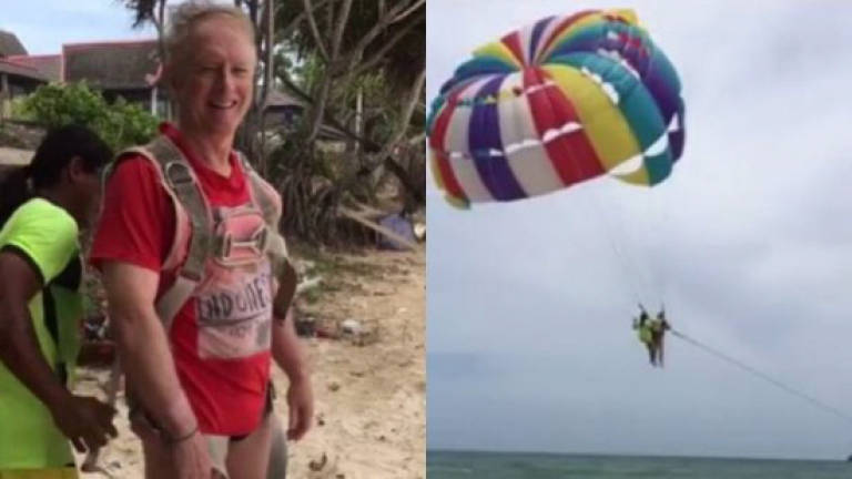 Two Thais charged over Aussie tourist parasailing death