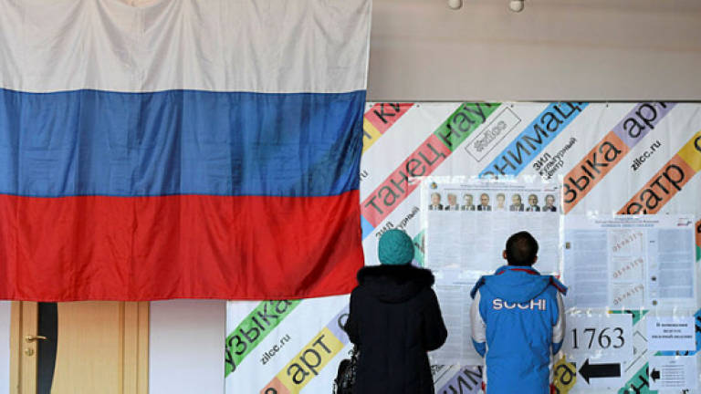 Russian voters share concerns in predictable poll
