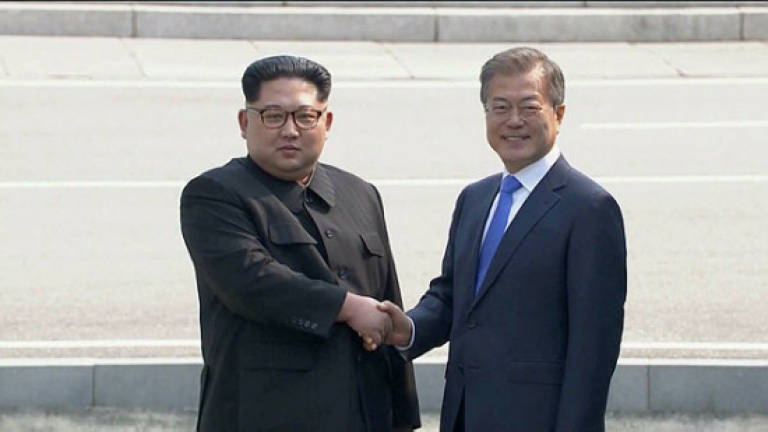 N. Korea's Kim says 'flooded with emotion' as he enters South Korea