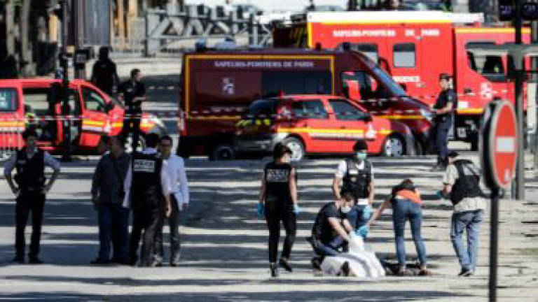 French police hold 4 family members of Champs-Elysees assailant