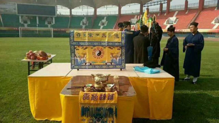 Fans of struggling football club turn to Taoist priests for help
