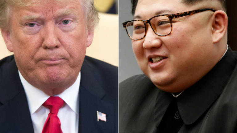 N. Korea's Kim turns from threats to hugs in diplomatic drive