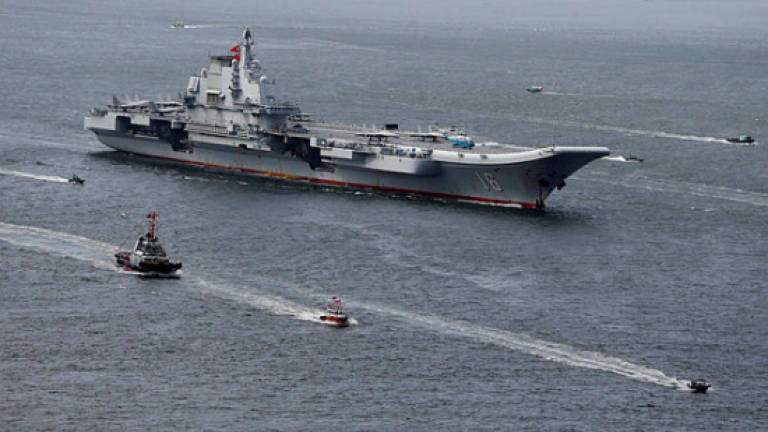 Chinese J-15 jets complete night landings on carrier in push to modernise