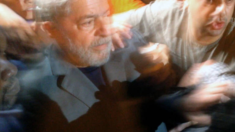 Lula's arrest leaves volatile Brazil stumbling