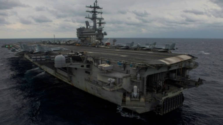 Massive search expands for US sailors after Philippine Sea air crash