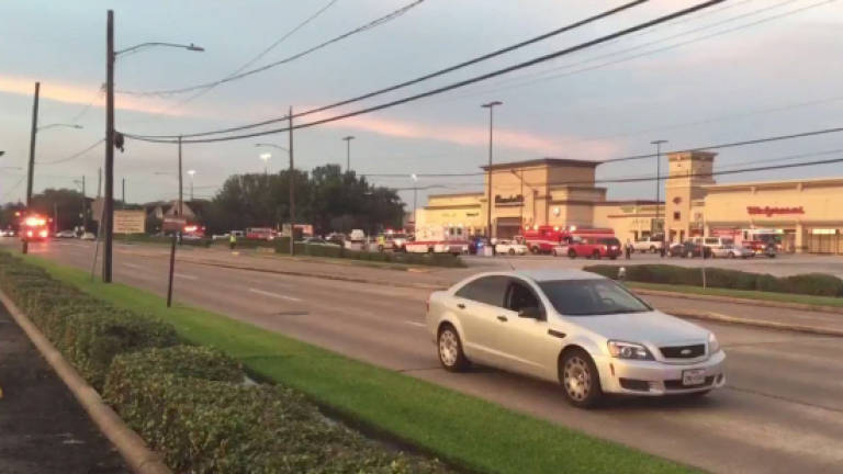 Nine injured in Houston shooting, suspect killed
