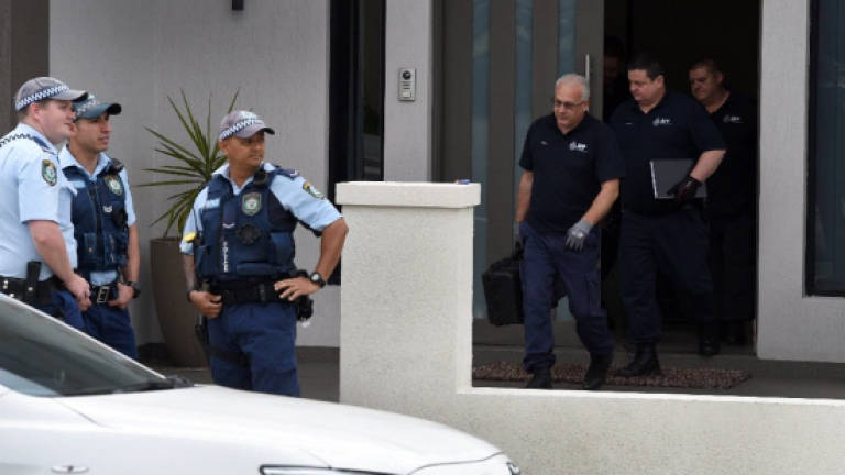Australian police charge four over terror killing