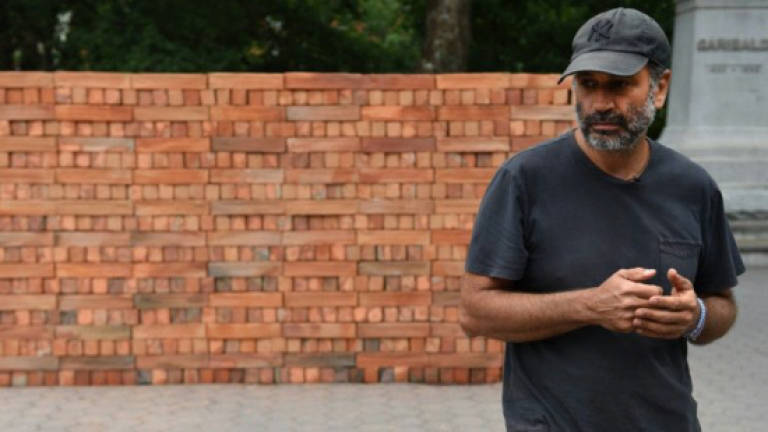 Mexican artist builds wall to tear down in New York