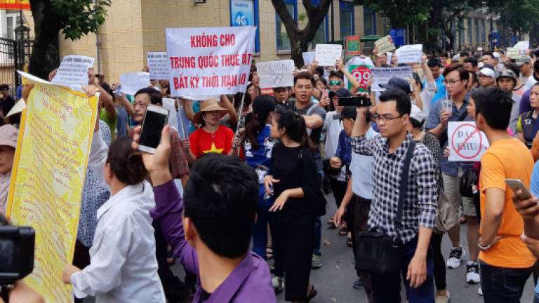 Vietnam police break up protest over controversial draft law