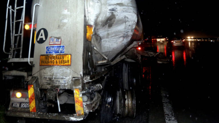 Tour bus crashes into rear of lorry, injuring two