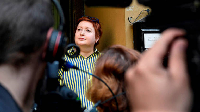 Top prisoner rights activist quits Russia after raid