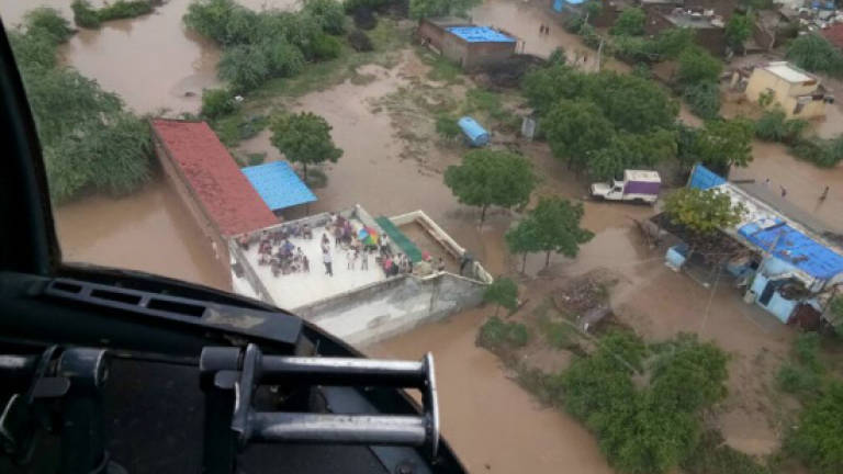 Death toll from India's monsoon floods climbs to 213