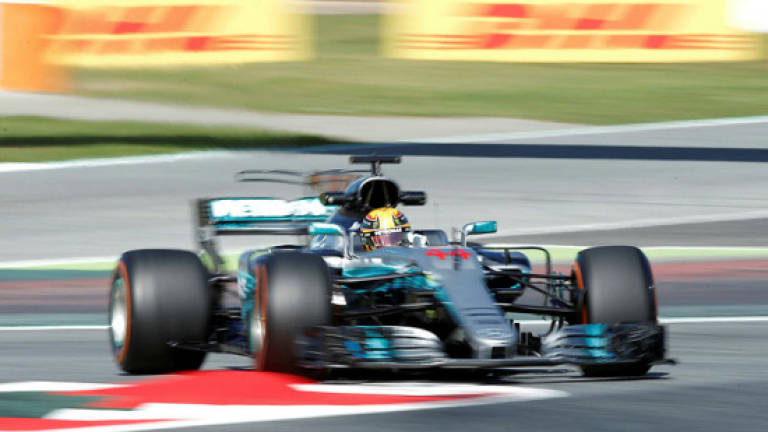 Hamilton back on top in Spain