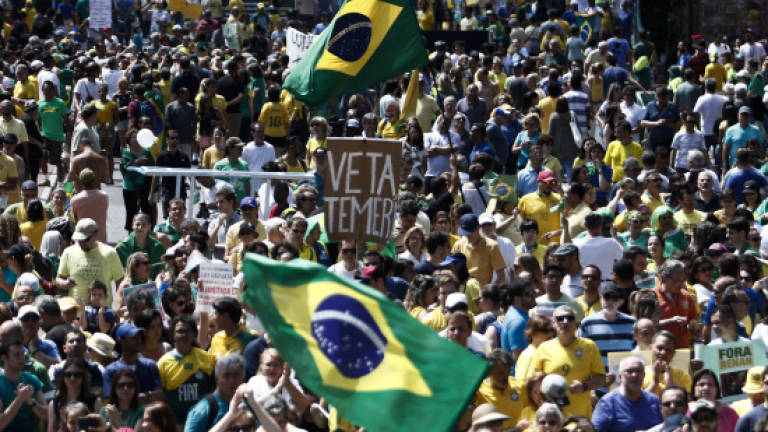 Brazilians protest corruption, target president's ally