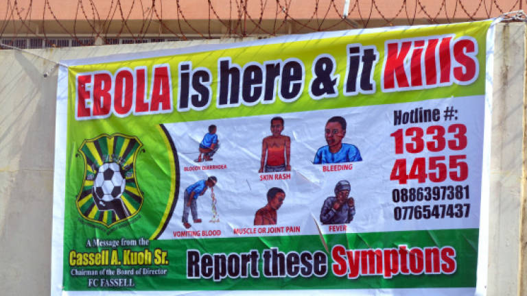 Liberia's Ebola clampdown turns violent as Asia fears new cases