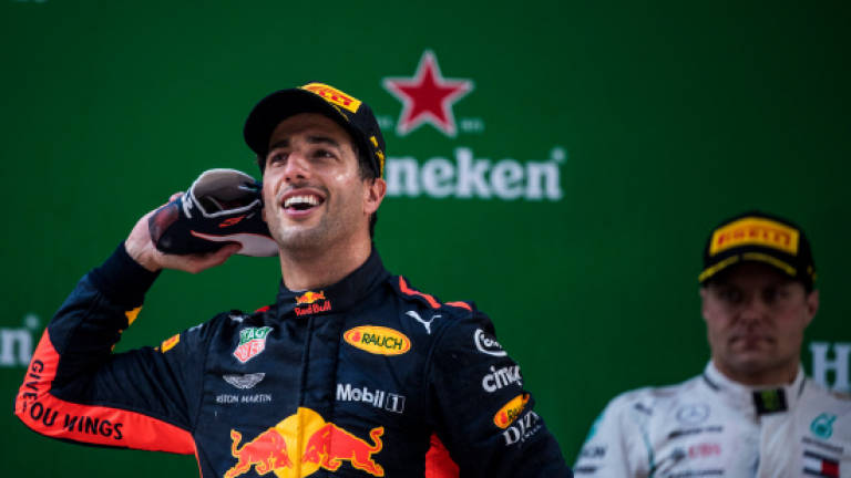 Ricciardo savours 'shoey' after storming to sensational Chinese GP win