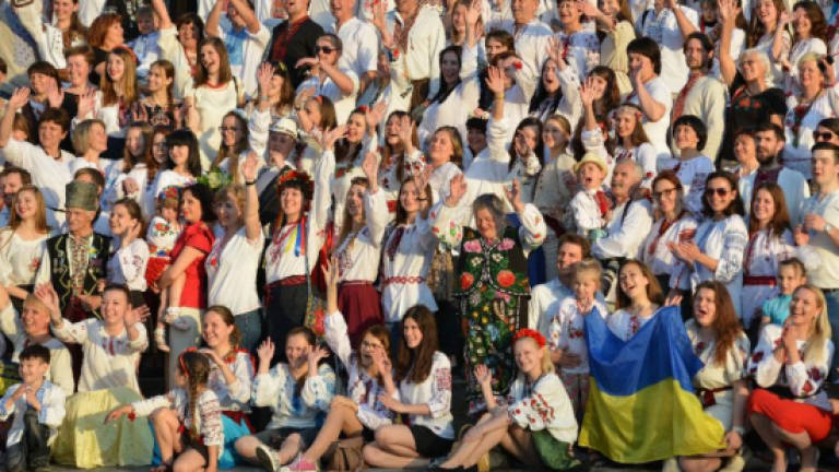 Ukrainians don embroidered shirts to show unity