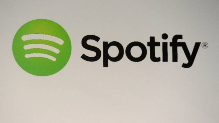 Spotify agrees to fund to settle copyright suits