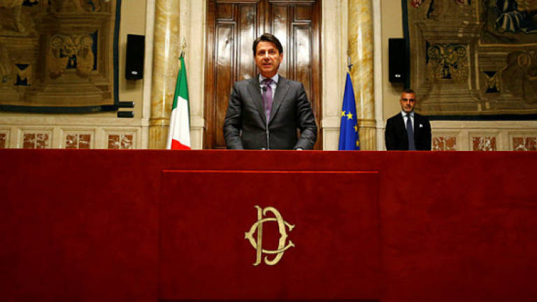 As Italy struggles to form a government, Moody's threatens downgrade