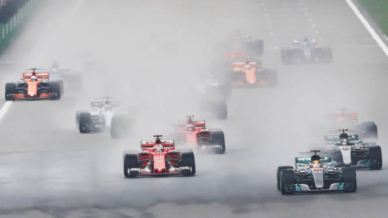Hamilton wins in China, Vettel second
