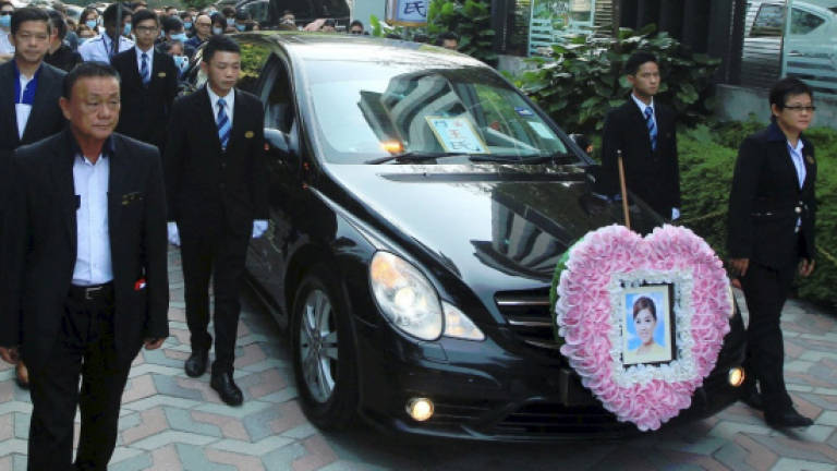 Murdered real estate agent laid to rest