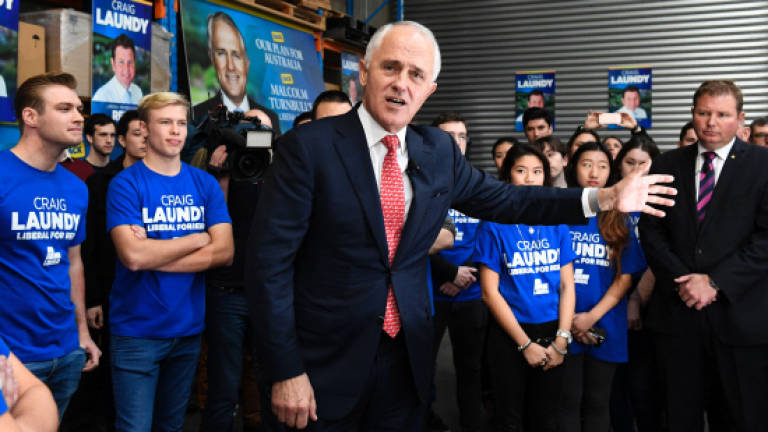 Polls point to cliffhanger on Australian election eve