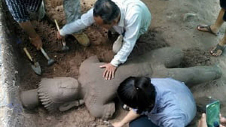 Ancient statue unearthed at Cambodia's Angkor complex