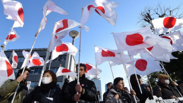 Teacher who sat for anthem deserved pay cut: Japan court