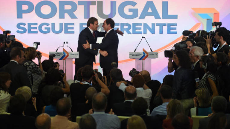 Portugal's austerity government wins re-election