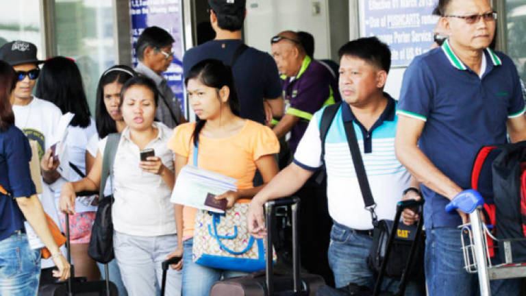 Philippines sees Asean agreement on migrant workers benefiting Filipinos