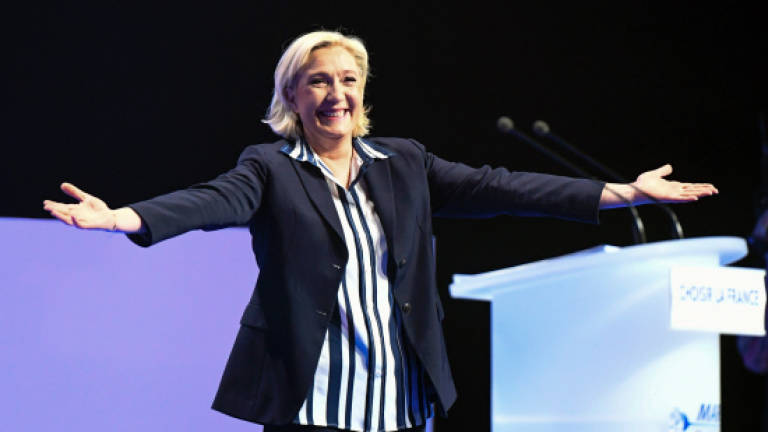 Le Pen says voters must choose 'for or against' France