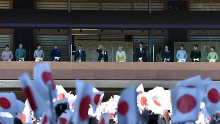 Japan's emperor greets New Year well-wishers as he prepares to abdicate