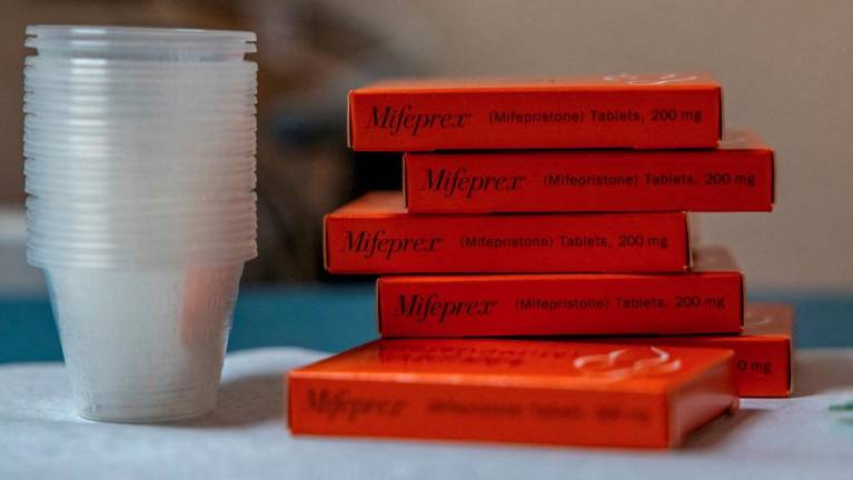 Boxes of mifepristone, the first pill given in a medical abortion, are prepared for patients - REUTERSPIX