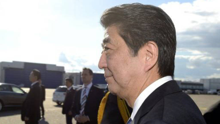Japan PM Abe's support dips to lowest level
