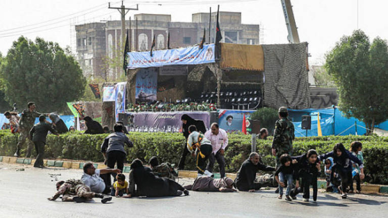 Iran vows 'crushing response' after gunmen kill 29 at army parade