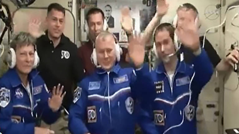 Russian spaceship delivers three astronauts to space station