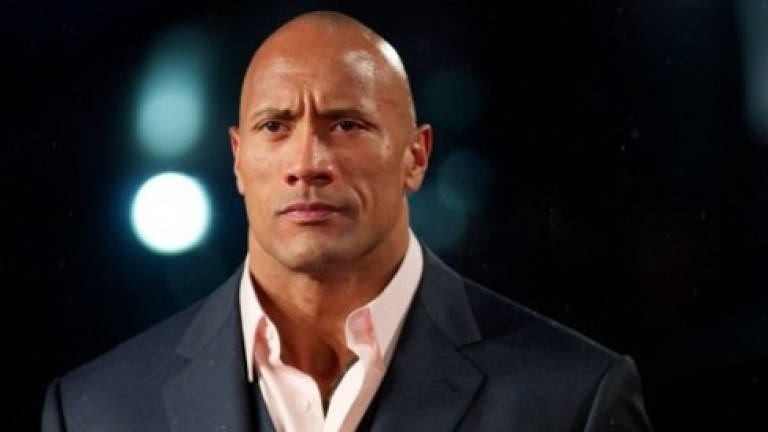 The Rock's clock app wants you to wrestle with goals